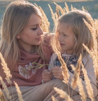 mother and daugter in field